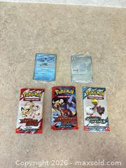 MaxSold Auction: New Pokémon Scarlet & Violet: 3 Sealed Packs + 2 Holo Singles - Welland (Ontario, Canada) SELLER MANAGED Reseller Online Auction - Young Road