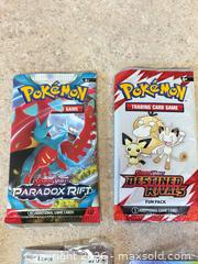 MaxSold Auction: New! Pokémon Trading Card Lot: Booster Packs, Single Cards, Stickers - Welland (Ontario, Canada) SELLER MANAGED Reseller Online Auction - Young Road