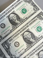 MaxSold Auction: 1995 Uncut Sheet of (16) $1 USD Bills with Storage Tube  - Toronto (Ontario, Canada) PARTNER MANAGED Reseller Online Auction - Queen Street West