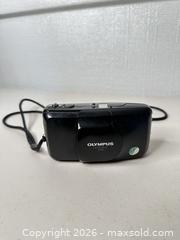 MaxSold Auction: Olympus Stylus Zoom 35mm Point & Shoot Film Camera - Black - San Jose (California, USA) SELLER MANAGED Downsizing Online Auction - East Humboldt Street