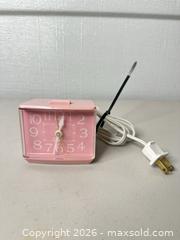 MaxSold Auction: Westclox Pink Plastic Alarm Clock (AC Plug-In) - San Jose (California, USA) SELLER MANAGED Downsizing Online Auction - East Humboldt Street