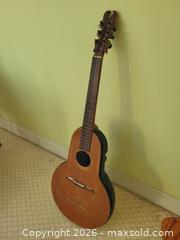 MaxSold Auction: Rare Handmade 6-String Guitar – Black Fiberglass Body, Teak Neck, Spruce Top. One of Only 2 - Stow (Massachusetts, USA) SELLER MANAGED Downsizing Online Auction - Great Road