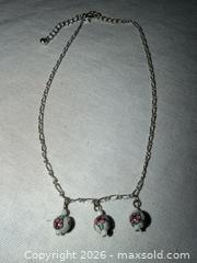 MaxSold Auction: PRETTY 15” SILVER TONE NECKLACE WITH 3 WHITE FLORAL CERAMIC CHARMS  - Warwick Township (Pennsylvania, USA) SELLER MANAGED Estate Sale Online Auction - Crocker Lane