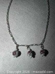 MaxSold Auction: PRETTY 15” SILVER TONE NECKLACE WITH 3 WHITE FLORAL CERAMIC CHARMS  - Warwick Township (Pennsylvania, USA) SELLER MANAGED Estate Sale Online Auction - Crocker Lane