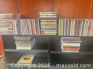MaxSold Auction: CD Collection and Holders - Houston (Texas, USA) SELLER MANAGED Downsizing Online Auction - Coleridge Street