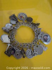 MaxSold Auction: Silver-Tone Multi-Charm Bracelet with Photo Locket - Trent Hills (Ontario, Canada) SELLER MANAGED Reseller Online Auction - Industrial Drive