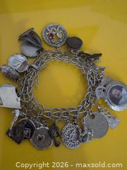 MaxSold Auction: Silver-Tone Multi-Charm Bracelet with Photo Locket - Trent Hills (Ontario, Canada) SELLER MANAGED Reseller Online Auction - Industrial Drive