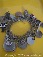 MaxSold Auction: Silver-Tone Multi-Charm Bracelet with Photo Locket - Trent Hills (Ontario, Canada) SELLER MANAGED Reseller Online Auction - Industrial Drive