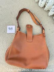 MaxSold Auction: Vintage Dooney & Bourke Donegal British Tan Leather Small Feed Bag - Novato (California, USA) SELLER MANAGED Estate Sale Online Auction - Nina Drive