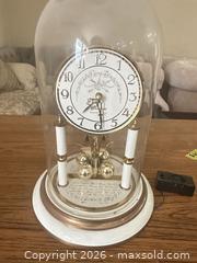 MaxSold Auction: Anniversary 400-Day Clock with Westminster Chime and Glass Dome - Las Vegas (Nevada, USA) PARTNER MANAGED Estate Sale Online Auction -  Argent Star Court