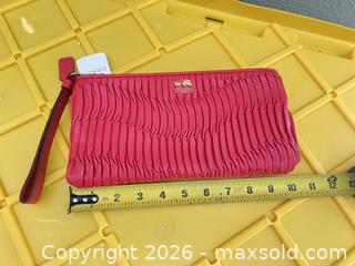 MaxSold Auction: Coach Coral Pink Leather Wristlet Clutch, 10" x 6" - Las Vegas (Nevada, USA) PARTNER MANAGED Estate Sale Online Auction -  Argent Star Court
