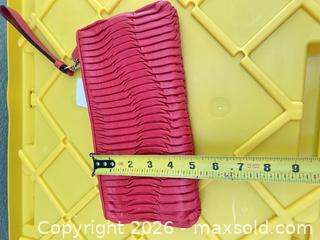 MaxSold Auction: Coach Coral Pink Leather Wristlet Clutch, 10" x 6" - Las Vegas (Nevada, USA) PARTNER MANAGED Estate Sale Online Auction -  Argent Star Court