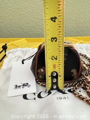 MaxSold Auction: Coach Leather Dinosaur Print Mini Crossbody Bag - Las Vegas (Nevada, USA) PARTNER MANAGED Estate Sale Online Auction -  Argent Star Court