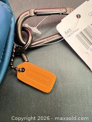 MaxSold Auction: Coach Leather Keychain / Key Fob Blue & Orange - Las Vegas (Nevada, USA) PARTNER MANAGED Estate Sale Online Auction -  Argent Star Court