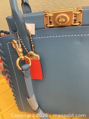 MaxSold Auction: Coach Medium Leather Handbag with Woven Trim & Turn-Lock - Las Vegas (Nevada, USA) PARTNER MANAGED Estate Sale Online Auction -  Argent Star Court