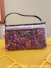 MaxSold Auction: Coach Purple Floral Wristlet Clutch with Silver Hardware - Las Vegas (Nevada, USA) PARTNER MANAGED Estate Sale Online Auction -  Argent Star Court