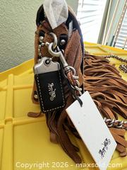 MaxSold Auction: Coach Tan Suede Leather Crossbody with Fringe & Studs - Las Vegas (Nevada, USA) PARTNER MANAGED Estate Sale Online Auction -  Argent Star Court