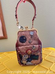 MaxSold Auction: Coach x Keith Herring Signature Patchwork Kisslock Clutch  - Las Vegas (Nevada, USA) PARTNER MANAGED Estate Sale Online Auction -  Argent Star Court