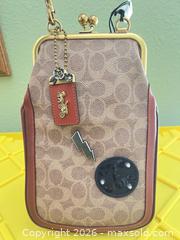 MaxSold Auction: Coach x Keith Herring Signature Patchwork Kisslock Clutch  - Las Vegas (Nevada, USA) PARTNER MANAGED Estate Sale Online Auction -  Argent Star Court