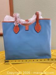 MaxSold Auction: Dooney & Bourke Light Blue All-Weather Leather Tote - Las Vegas (Nevada, USA) PARTNER MANAGED Estate Sale Online Auction -  Argent Star Court