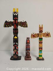 MaxSold Auction: Lot of 3 Souvenir Indigenous Northwest Cost Totem Poles - Toronto (Ontario, Canada) PARTNER MANAGED Reseller Online Auction - Queen Street West.