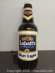 MaxSold Auction: Vintage Wall-Mounted Lobatt Blue Light Bottle Light - Toronto (Ontario, Canada) PARTNER MANAGED Reseller Online Auction - Queen Street West.