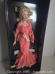 MaxSold Auction: Franklin Mint Marilyn Monroe Collector Doll, 16 in, Coral Outfit - Lakeland (Florida, USA) PARTNER MANAGED Downsizing Online Auction - Shore Acres Drive