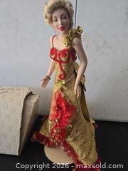 MaxSold Auction: Marilyn Monroe Franklin Heirloom Bisque Porcelain Head Doll, Gold & Red Outfit - Lakeland (Florida, USA) PARTNER MANAGED Downsizing Online Auction - Shore Acres Drive