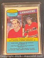 MaxSold Auction: 1980-1 O-Pee-Chee Montreal Canadiens Team Leaders Guy Lafleur and Pierre Larouche Hockey Collectible Trading Card  - Newmarket (Ontario, Canada) PARTNER MANAGED Reseller Online Auction - Walter Avenue