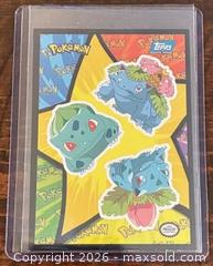 MaxSold Auction: 1999 Topps Pokémon: The First Movie Sticker evolution line of Bulbasaur, Ivysaur, and Venusaur Collectible Trading Card  - Newmarket (Ontario, Canada) PARTNER MANAGED Reseller Online Auction - Walter Avenue