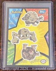 MaxSold Auction: 1999 Topps Pokémon: The First Movie Sticker Geodude, Graveler, and Golem Collectible Trading Card  - Newmarket (Ontario, Canada) PARTNER MANAGED Reseller Online Auction - Walter Avenue