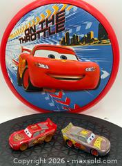 MaxSold Auction: Disney Frisbee Cars and die-cast cars of two different versions of Lightning McQueen  - Menlo Park (California, USA) SELLER MANAGED Downsizing Online Auction - Henderson Place