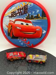 MaxSold Auction: Disney Frisbee Cars and die-cast cars of two different versions of Lightning McQueen  - Menlo Park (California, USA) SELLER MANAGED Downsizing Online Auction - Henderson Place