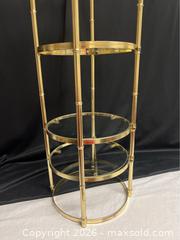 MaxSold Auction: 1970s Vintage Cylindrical Gold Brass Five Tier Étagère With Glass Shelves MCM - Campbell (California, USA) SELLER MANAGED Downsizing Online Auction - Dell Avenue