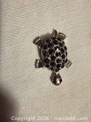 MaxSold Auction: 1.25” VINTAGE SILVER TONE W BLACK MARCASITE STONE TURTLE W/ RED GEM EYES DECORATION  - Warwick Township (Pennsylvania, USA) SELLER MANAGED Estate Sale Online Auction - Crocker Lane