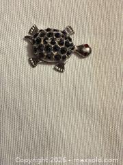MaxSold Auction: 1.25” VINTAGE SILVER TONE W BLACK MARCASITE STONE TURTLE W/ RED GEM EYES DECORATION  - Warwick Township (Pennsylvania, USA) SELLER MANAGED Estate Sale Online Auction - Crocker Lane