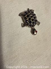 MaxSold Auction: 1.25” VINTAGE SILVER TONE W BLACK MARCASITE STONE TURTLE W/ RED GEM EYES DECORATION  - Warwick Township (Pennsylvania, USA) SELLER MANAGED Estate Sale Online Auction - Crocker Lane