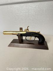 MaxSold Auction: Lighter Brass Flintlock Decorative Replica  - San Jose (California, USA) SELLER MANAGED Downsizing Online Auction - East Humboldt Street