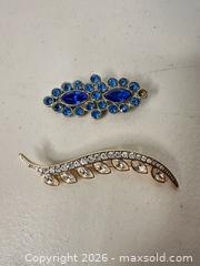 MaxSold Auction: Monet Two-Tone Gold & Silver Tone Brooch, 2–3 in - San Jose (California, USA) SELLER MANAGED Downsizing Online Auction - East Humboldt Street