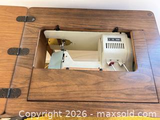 MaxSold Auction: Adler Vintage Mechanical Sewing Machine in Wood Cabinet - Wake Forest (North Carolina, USA) PARTNER MANAGED Downsizing Online Auction - Wait Avenue