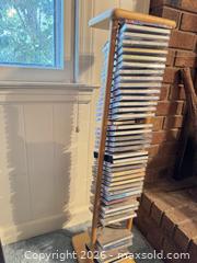 MaxSold Auction: Light Wood CD Tower / Media Rack — Holds ~40–60 CDs - Wake Forest (North Carolina, USA) PARTNER MANAGED Downsizing Online Auction - Wait Avenue