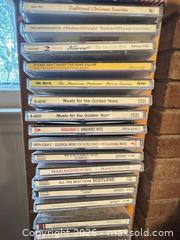 MaxSold Auction: Light Wood CD Tower / Media Rack — Holds ~40–60 CDs - Wake Forest (North Carolina, USA) PARTNER MANAGED Downsizing Online Auction - Wait Avenue