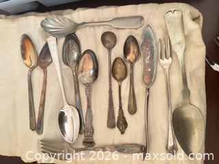 MaxSold Auction: Mixed Silver-Plated Flatware Set with Storage Roll - Wake Forest (North Carolina, USA) PARTNER MANAGED Downsizing Online Auction - Wait Avenue