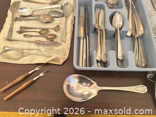 MaxSold Auction: Mixed Silver-Plated Flatware Set with Storage Roll - Wake Forest (North Carolina, USA) PARTNER MANAGED Downsizing Online Auction - Wait Avenue