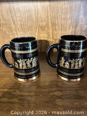 MaxSold Auction: Pair of Black & Gold Porcelain Steins with Greek Figures - Wake Forest (North Carolina, USA) PARTNER MANAGED Downsizing Online Auction - Wait Avenue