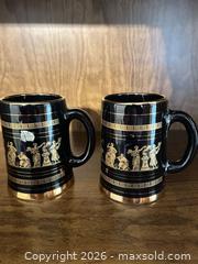 MaxSold Auction: Pair of Black & Gold Porcelain Steins with Greek Figures - Wake Forest (North Carolina, USA) PARTNER MANAGED Downsizing Online Auction - Wait Avenue