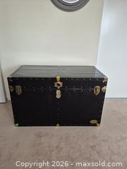 MaxSold Auction: Large Black Steamer Trunk with Brass Accents - Ajax (Ontario, Canada) PARTNER MANAGED Downsizing Online Auction - Grainger Crescent