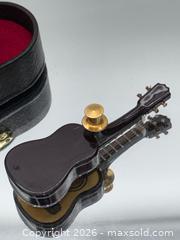 MaxSold Auction: Collectible miniature acoustic guitar lapel pin - Menlo Park (California, USA) SELLER MANAGED Downsizing Online Auction - Henderson Place