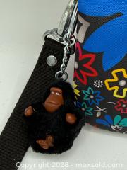 MaxSold Auction: Kipling Creativity Extra Large Wristlet with colorful floral pattern and monkey keychain - Menlo Park (California, USA) SELLER MANAGED Downsizing Online Auction - Henderson Place