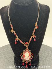 MaxSold Auction: Victorian-style necklace featuring a cameo pendant with red and white accents - Menlo Park (California, USA) SELLER MANAGED Downsizing Online Auction - Henderson Place
